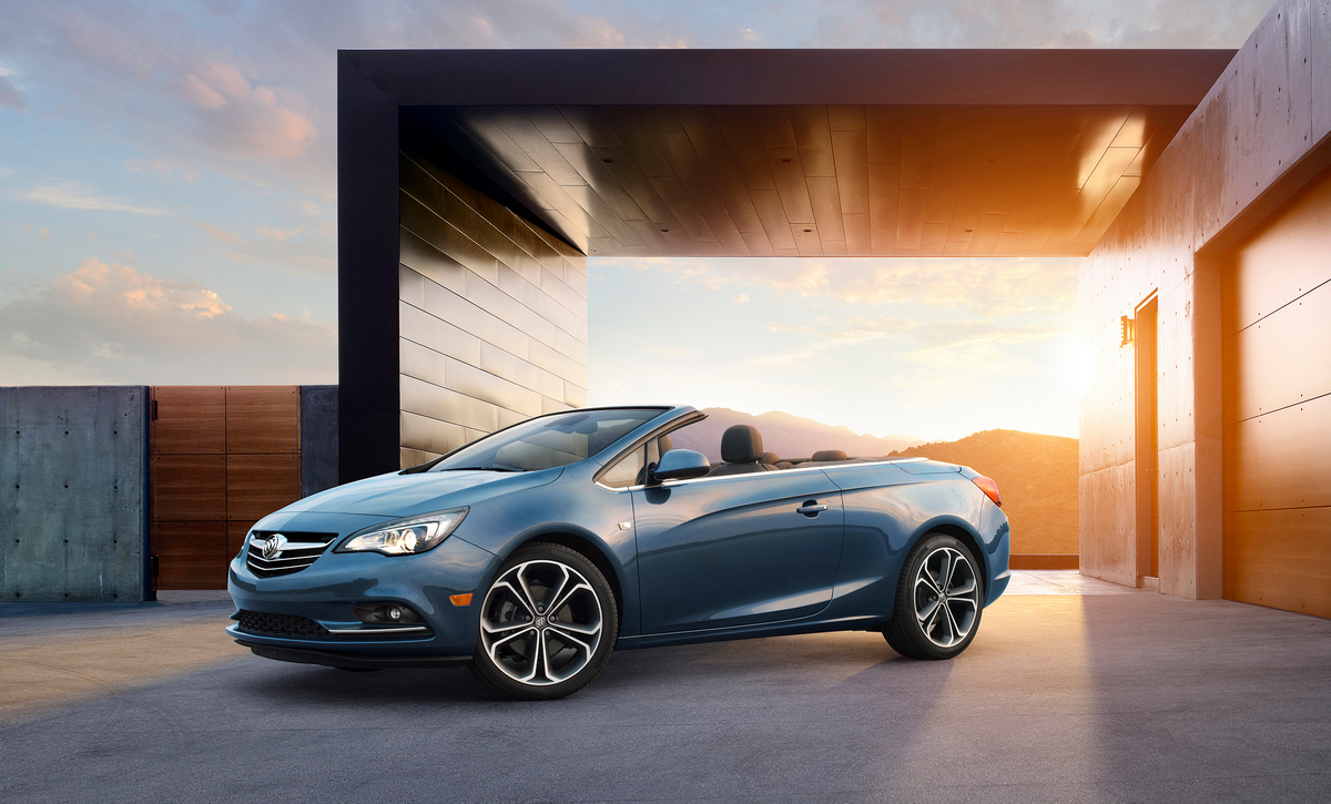Buick Cascada Convertible, still ¾ front angle with roof down. Vehicle is shown in Deep Sky Metallic exterior color, ebony leather interior and 20-inch wheels © General Motors