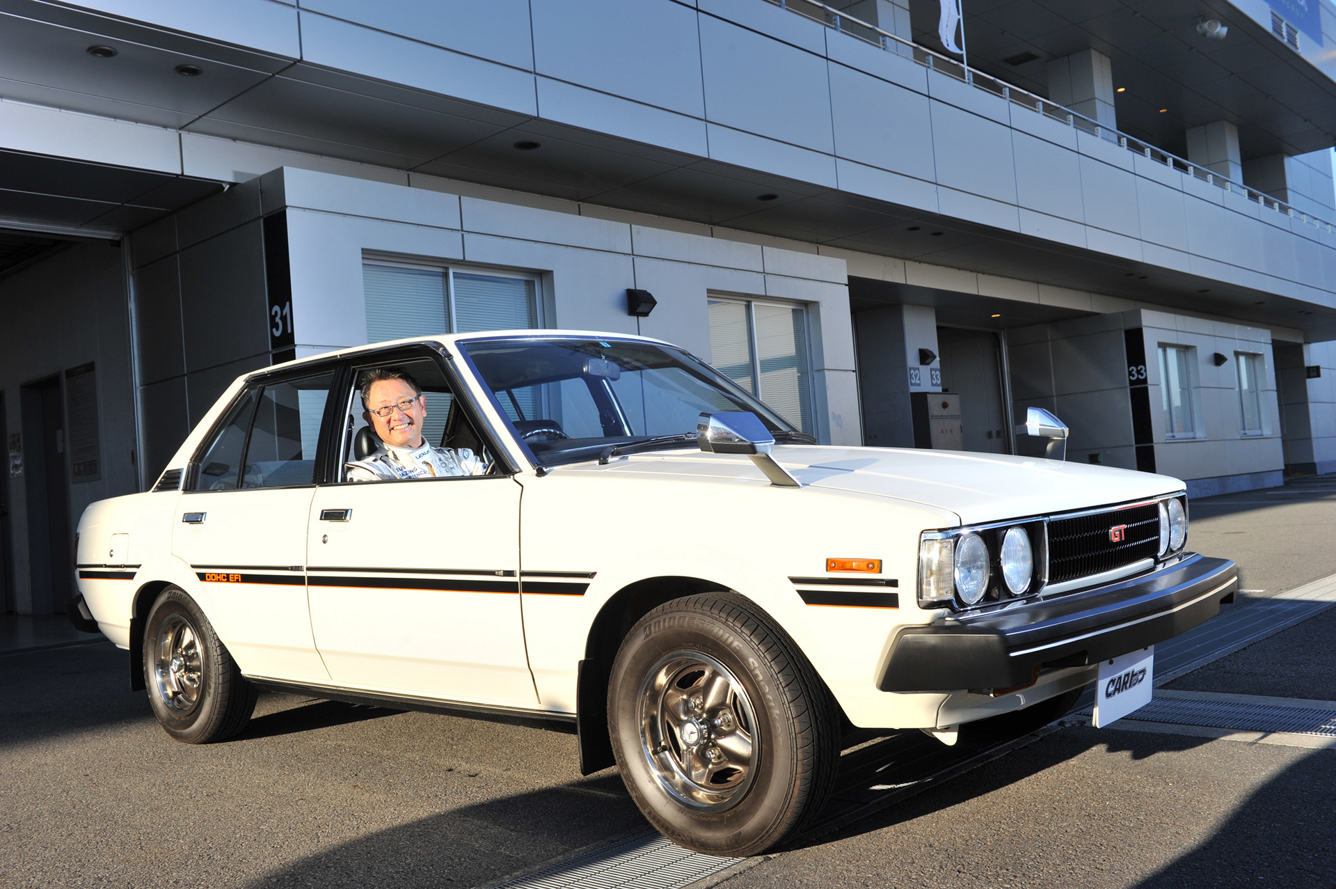 Toyota Motor Corporation President Akio Toyoda rolls out in a 4-door Corolla GT like the one that captured his heart in the 1980s © Toyota Motor Corporation
