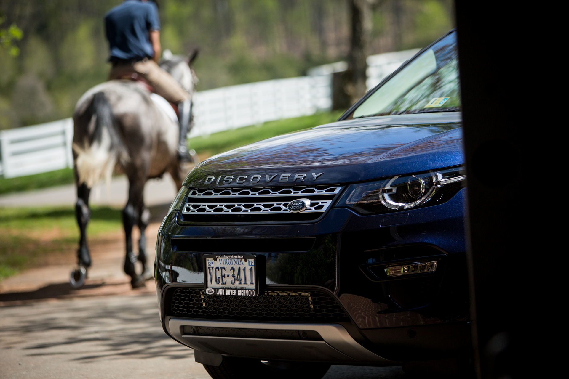 Will Coleman, USA Equestrian Event Rider rides Cooley Gideon with his 2016 Land Rover Discovery Sport in the foreground © Tata Group
