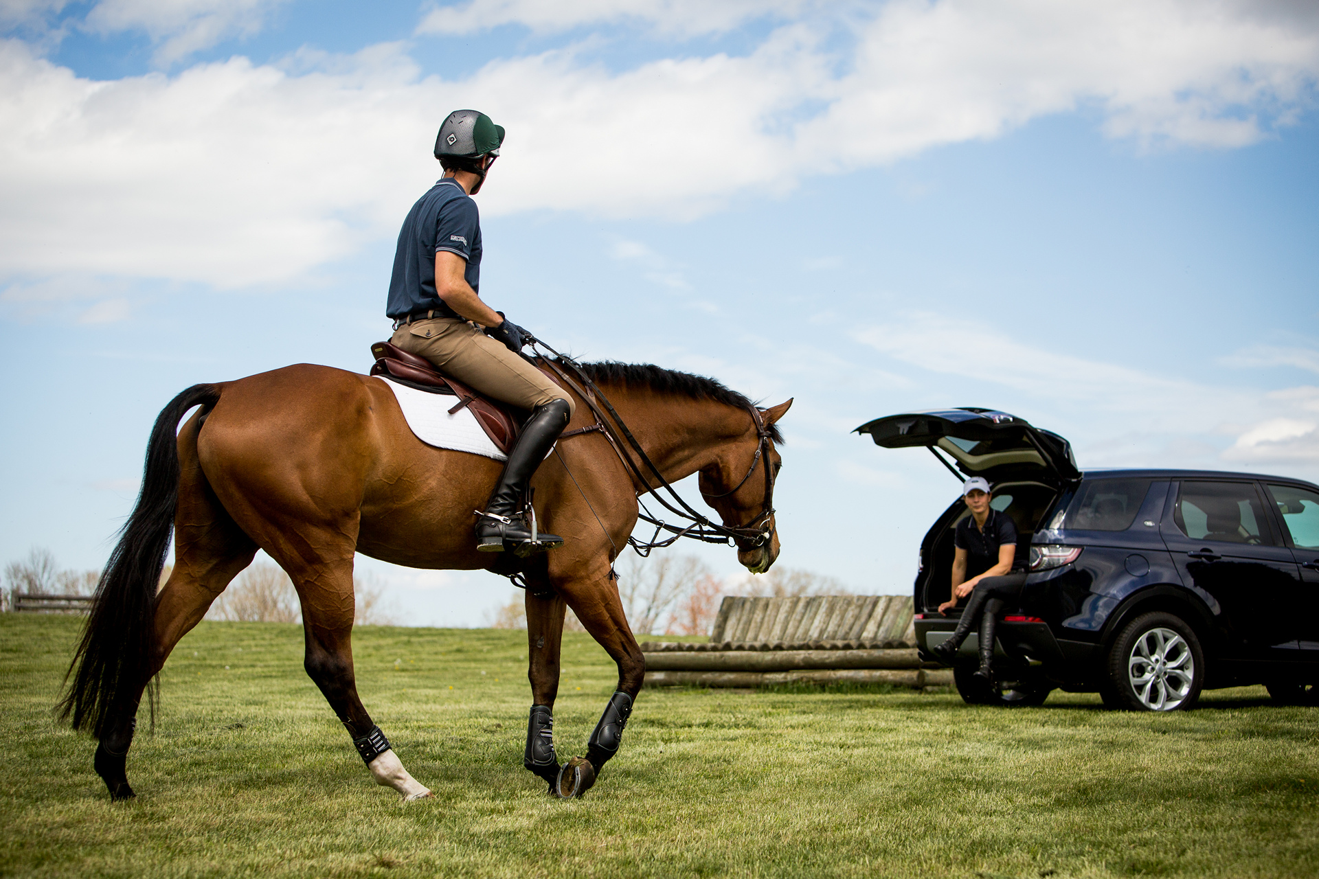 Will Coleman, USA Equestrian Event Rider rides Butch Cassidy with his 2016 Land Rover Discovery Sport in background © Tata Group