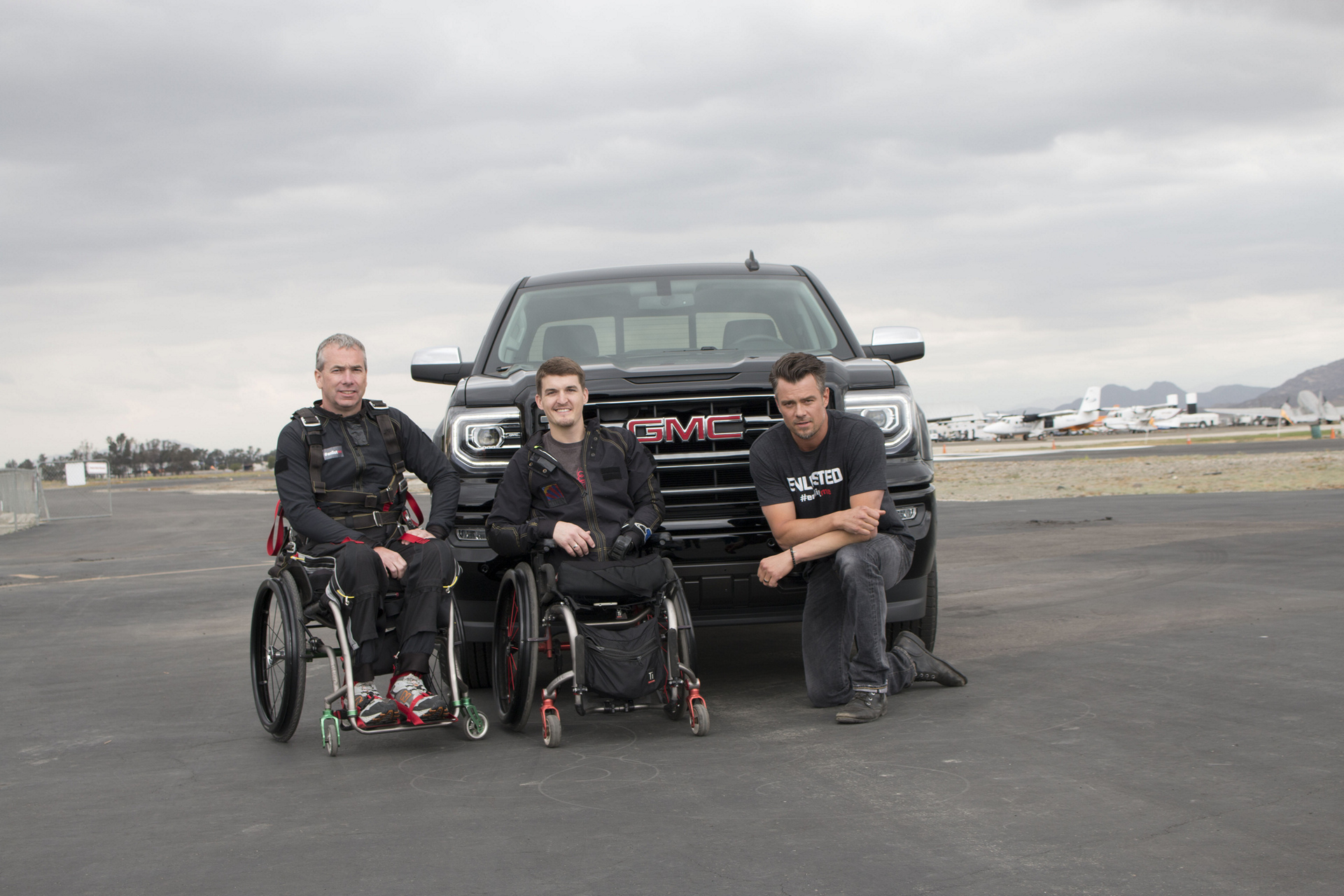 Army Staff Sergeant Stephen Valyou and Marine Corporal Todd Love with Josh Duhamel © General Motors